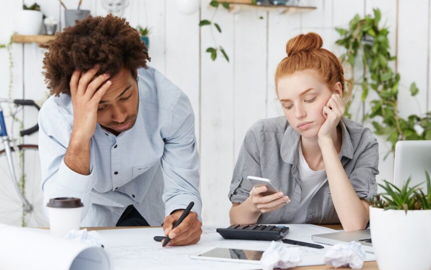 frustrated-unhappy-afro-american-male-engineer-making-drawings-looking-tired-sleepy_273609-14174