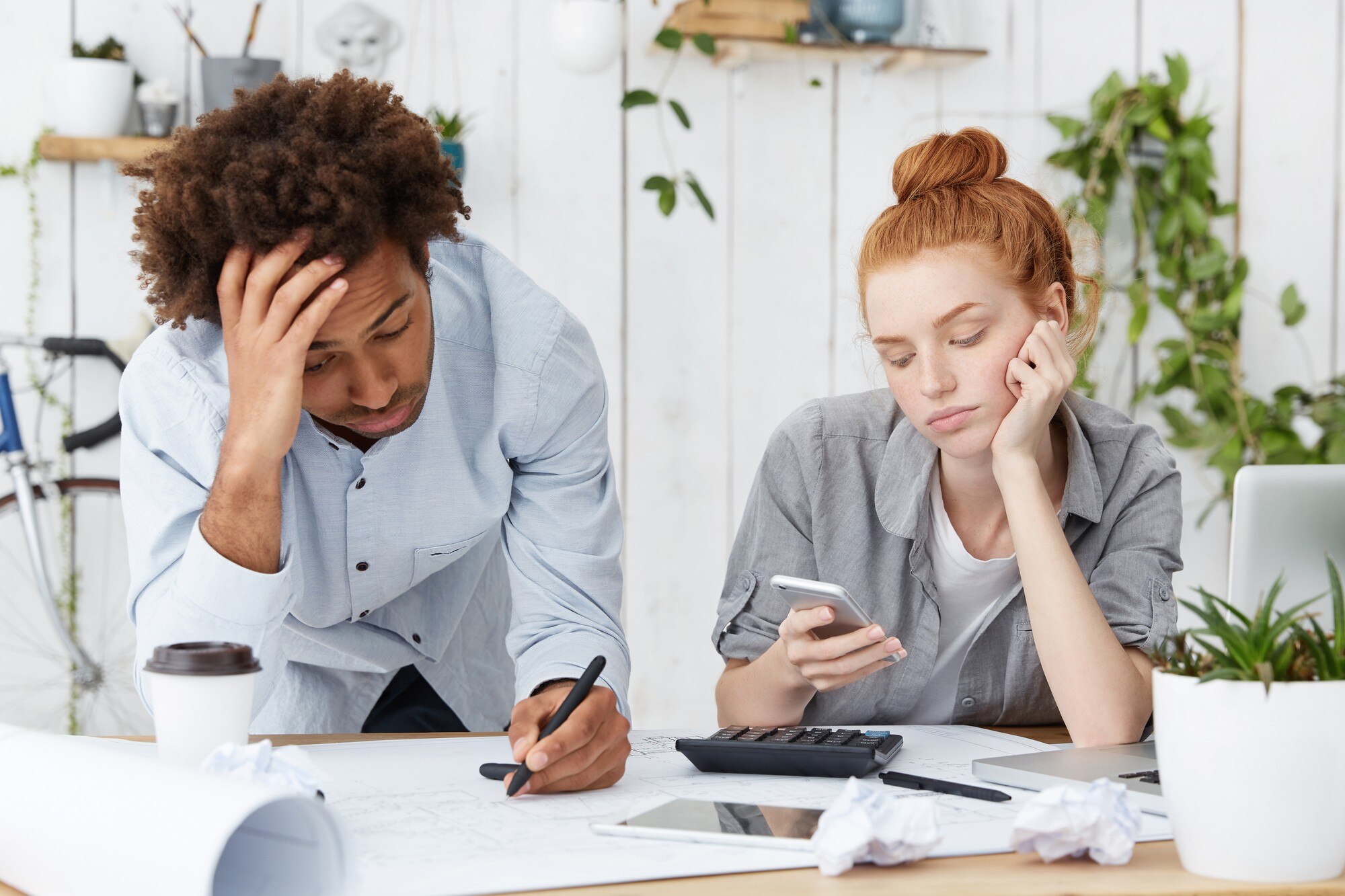 frustrated-unhappy-afro-american-male-engineer-making-drawings-looking-tired-sleepy_273609-14174